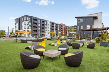 outdoor lounge with firepit at Discovery West Apartments in  Issaquah, WA 98029